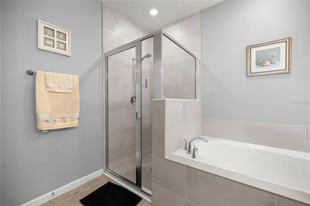 a bathroom with a bathtub and a shower