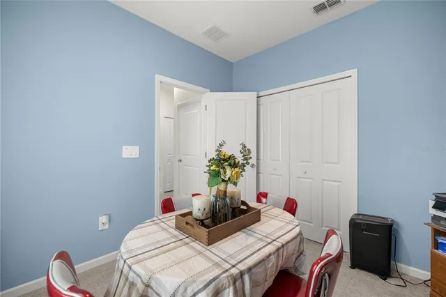 a view of a workspace with furniture