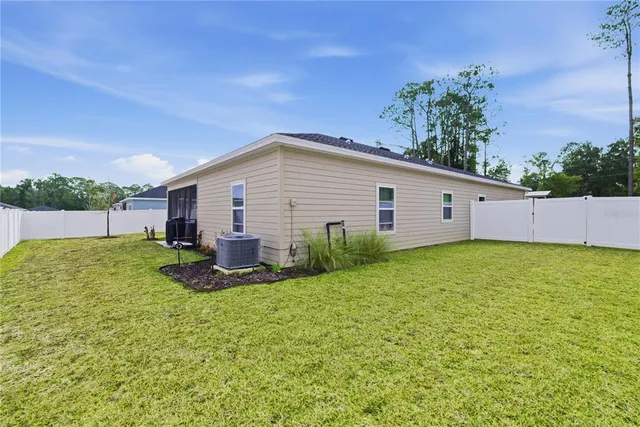 a view of a backyard with plants and a garden