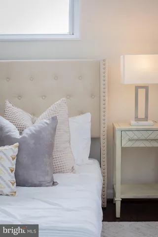 a bedroom with a bed and a fireplace