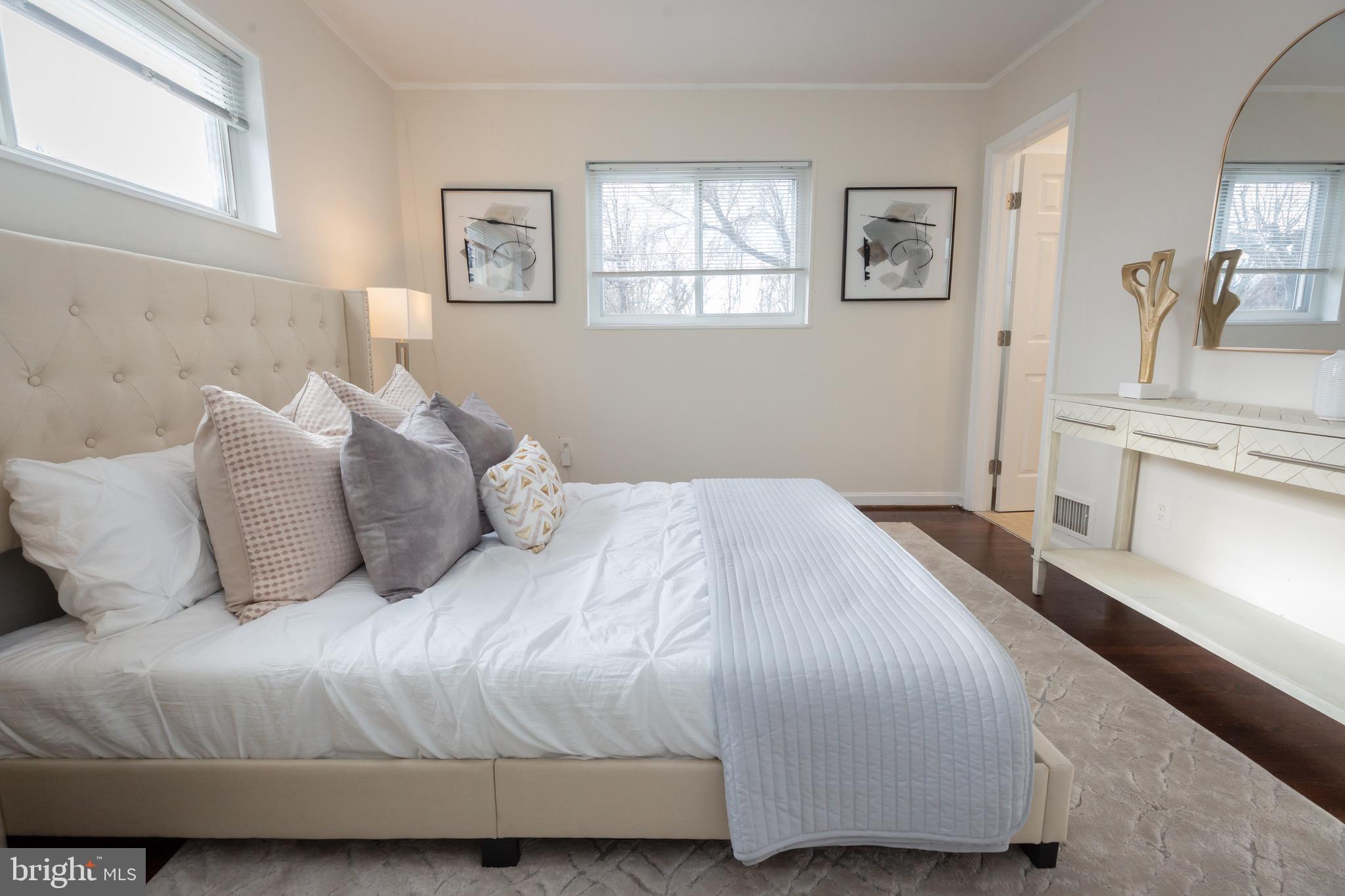 3945 Wendy Lane Silver Spring, MD 20906 - Photo 16 of 45 a bedroom with a bed and a couch