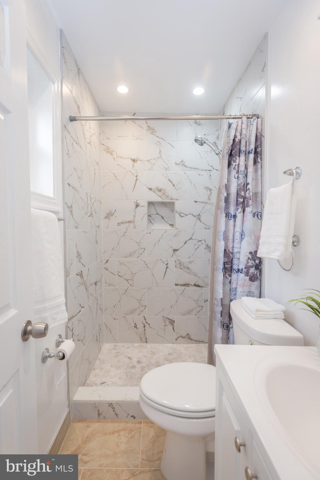 3945 Wendy Lane Silver Spring, MD 20906 - Photo 18 of 45 a bathroom with a toilet sink and shower