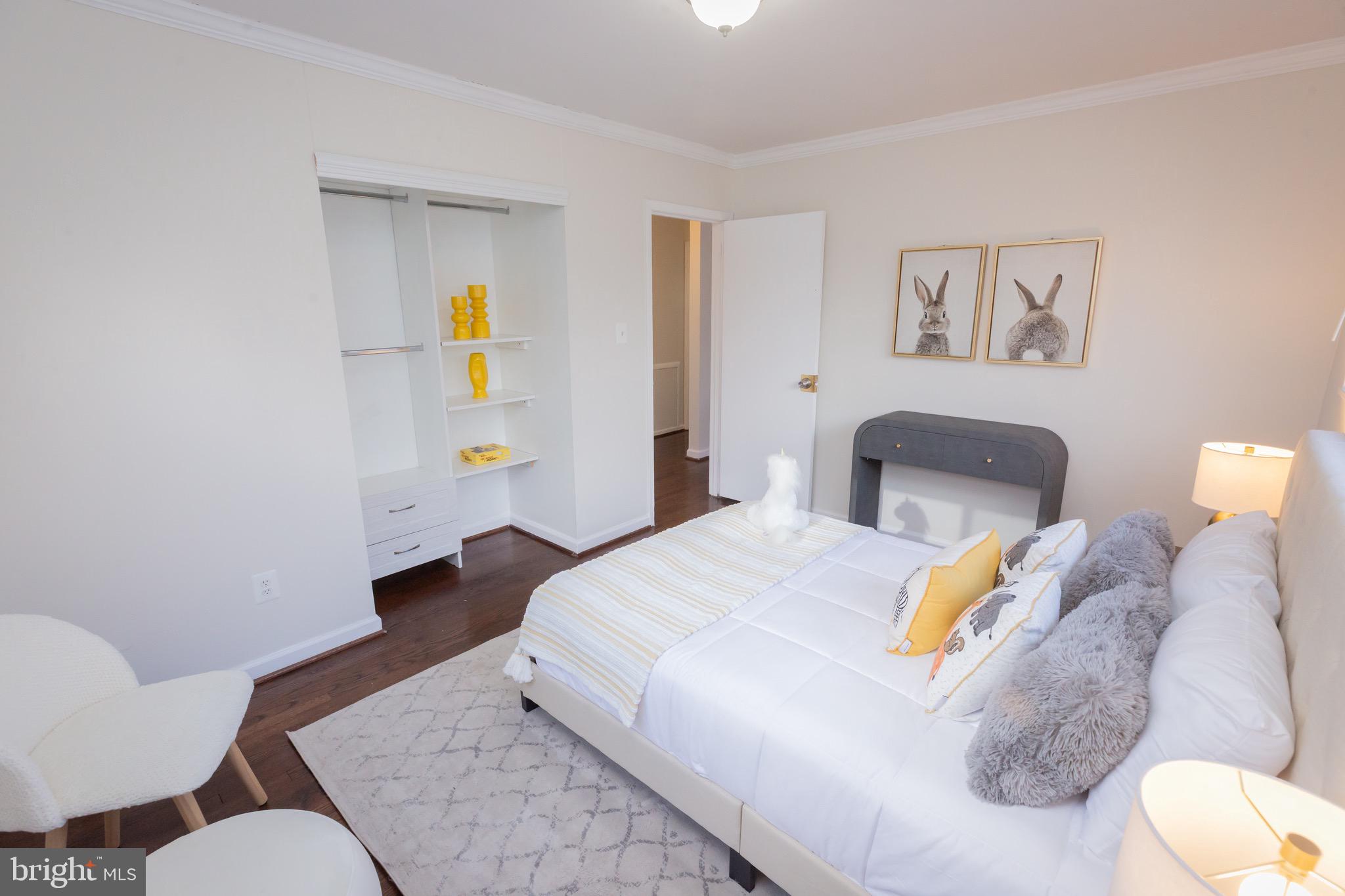 3945 Wendy Lane Silver Spring, MD 20906 - Photo 22 of 45 a bedroom with a bed and wooden floor