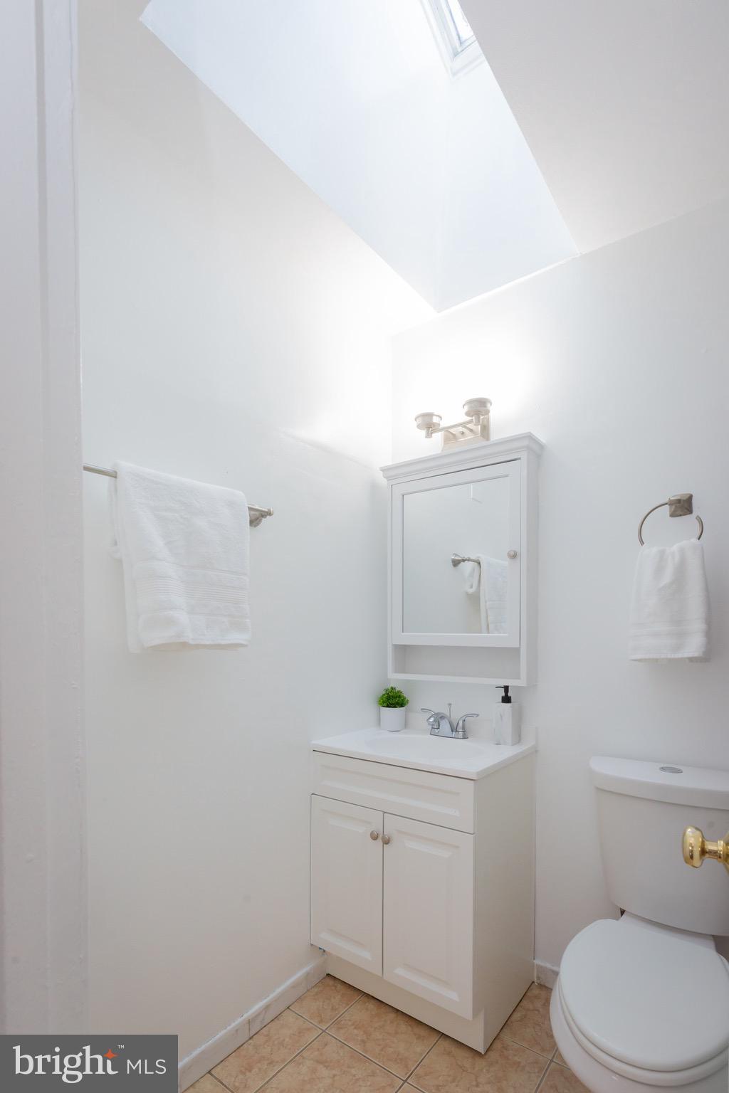 3945 Wendy Lane Silver Spring, MD 20906 - Photo 24 of 45 a bathroom with a sink vanity and toilet