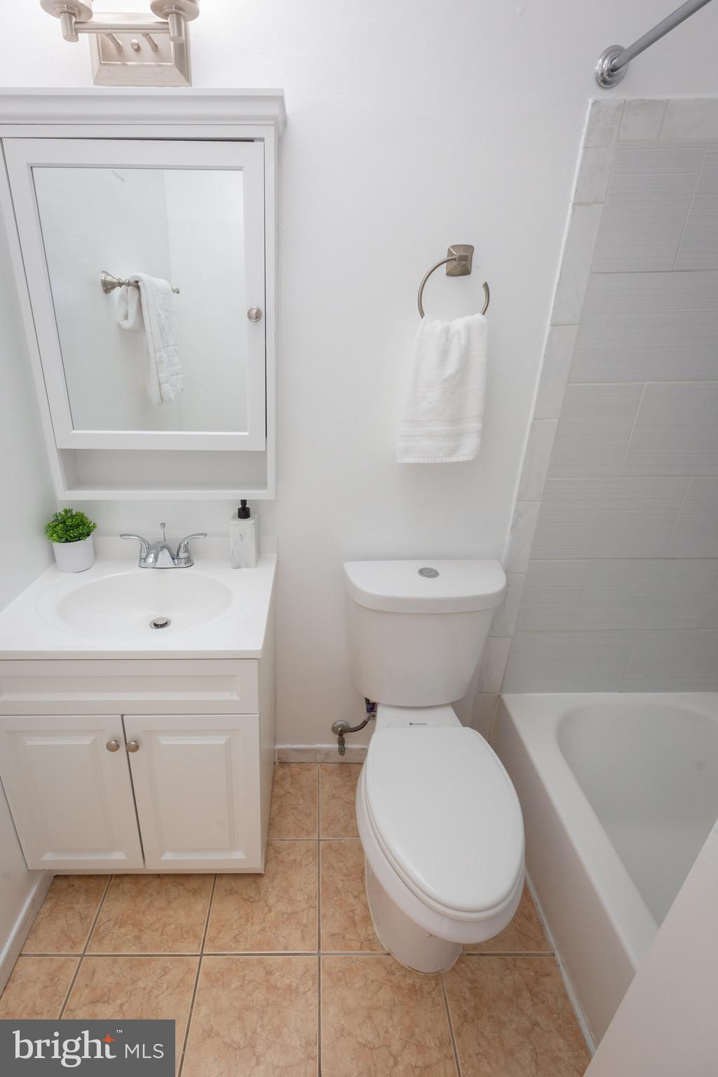 3945 Wendy Lane Silver Spring, MD 20906 - Photo 25 of 45 a bathroom with a sink toilet and shower