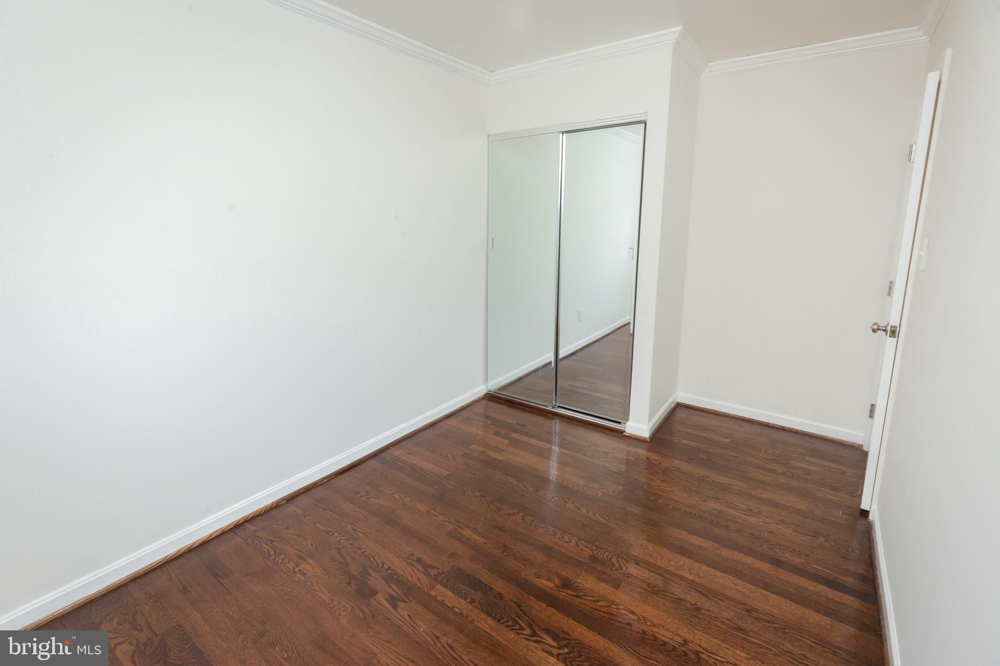 3945 Wendy Lane Silver Spring, MD 20906 - Photo 27 of 45 a view of an empty room with wooden floor