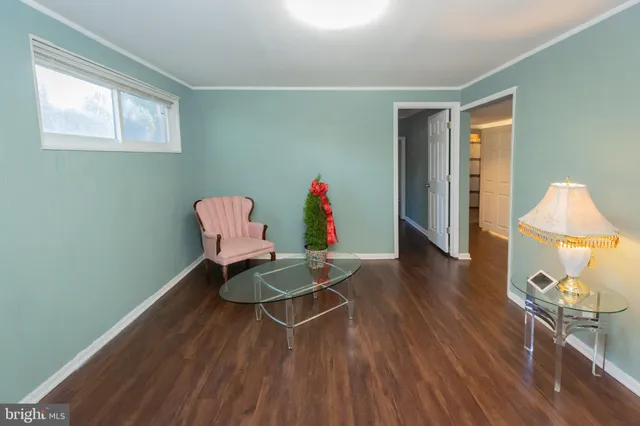 a workspace with furniture and wooden floor