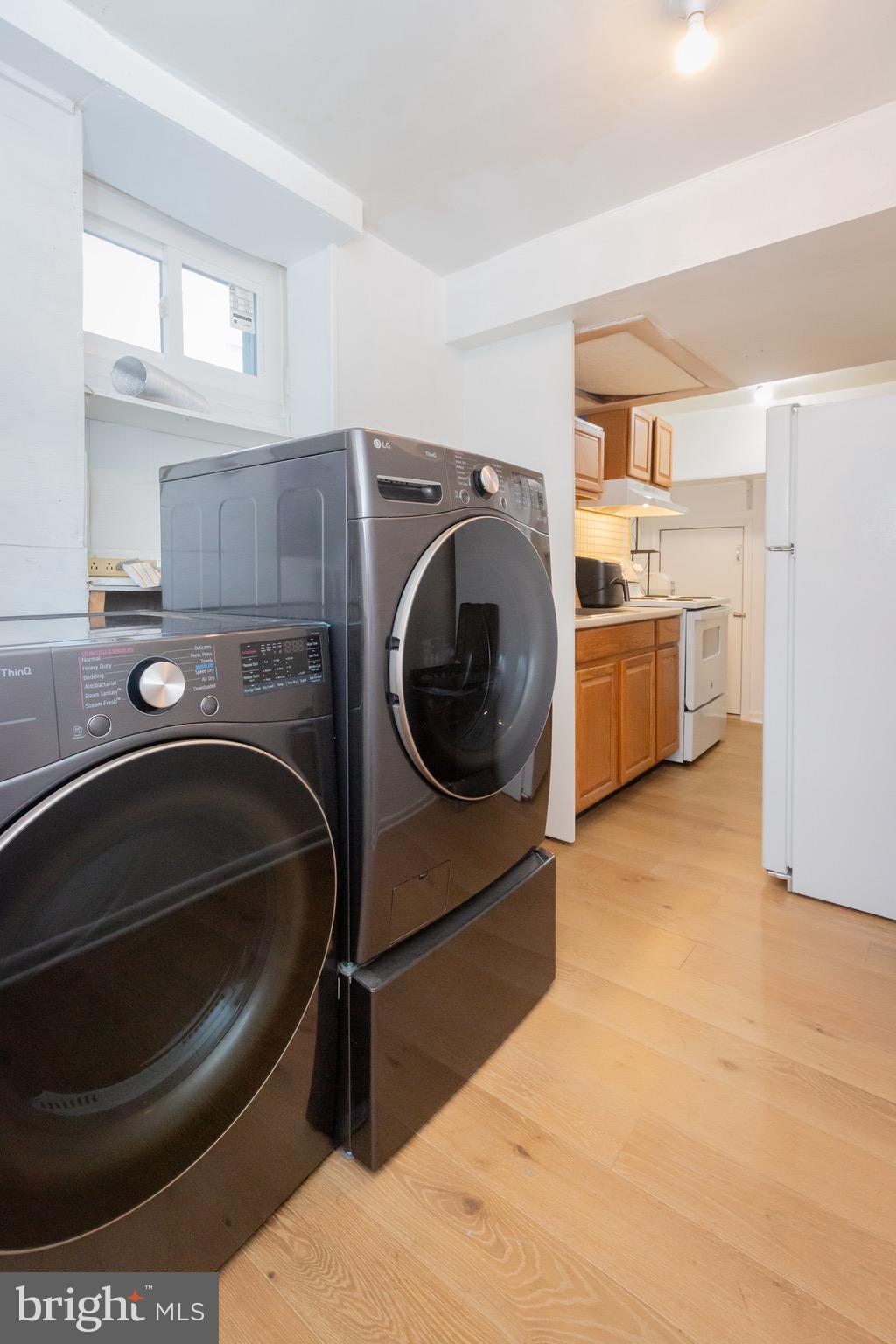 3945 Wendy Lane Silver Spring, MD 20906 - Photo 32 of 45 a utility room with sink dryer and washer