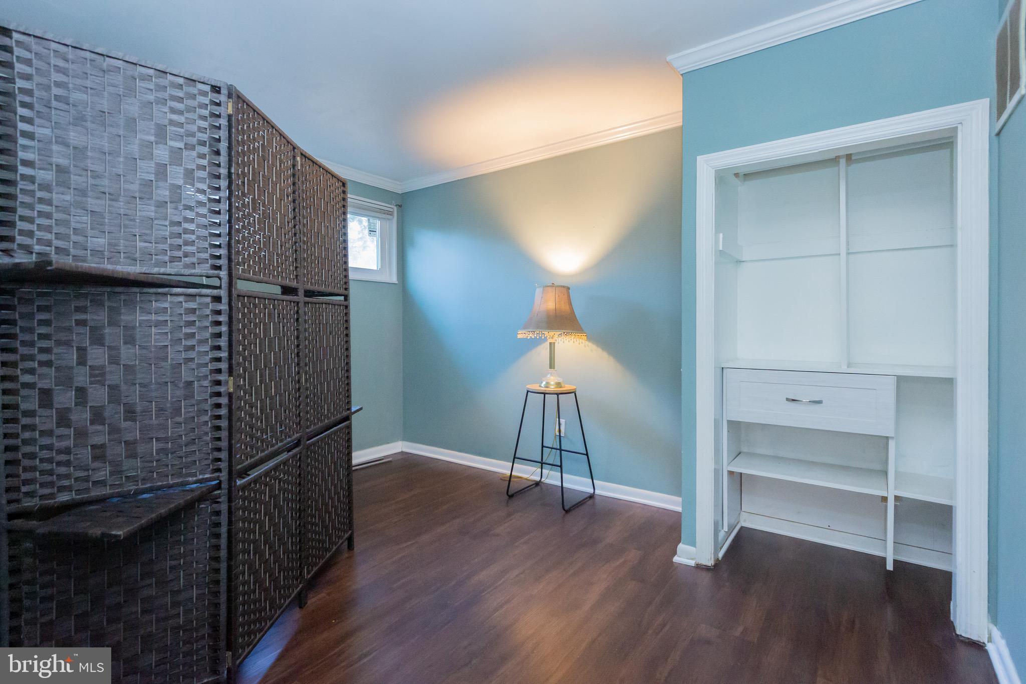 3945 Wendy Lane Silver Spring, MD 20906 - Photo 35 of 45 a view of a livingroom with wooden floor and stairs