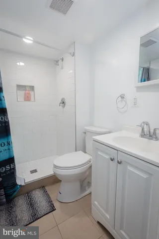 a bathroom with a sink toilet and vanity
