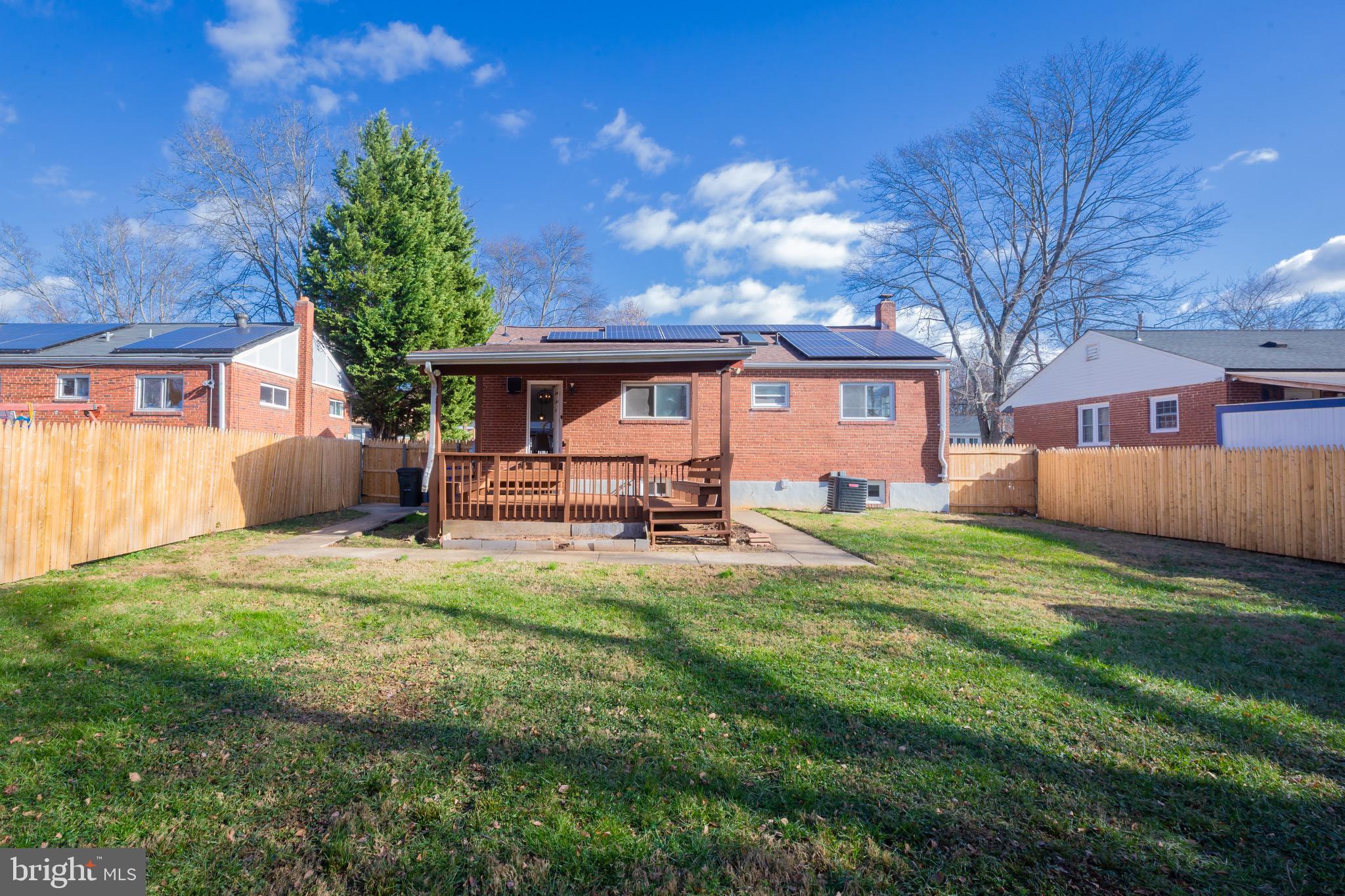 3945 Wendy Lane Silver Spring, MD 20906 - Photo 40 of 45 a backyard of a house with table and chairs