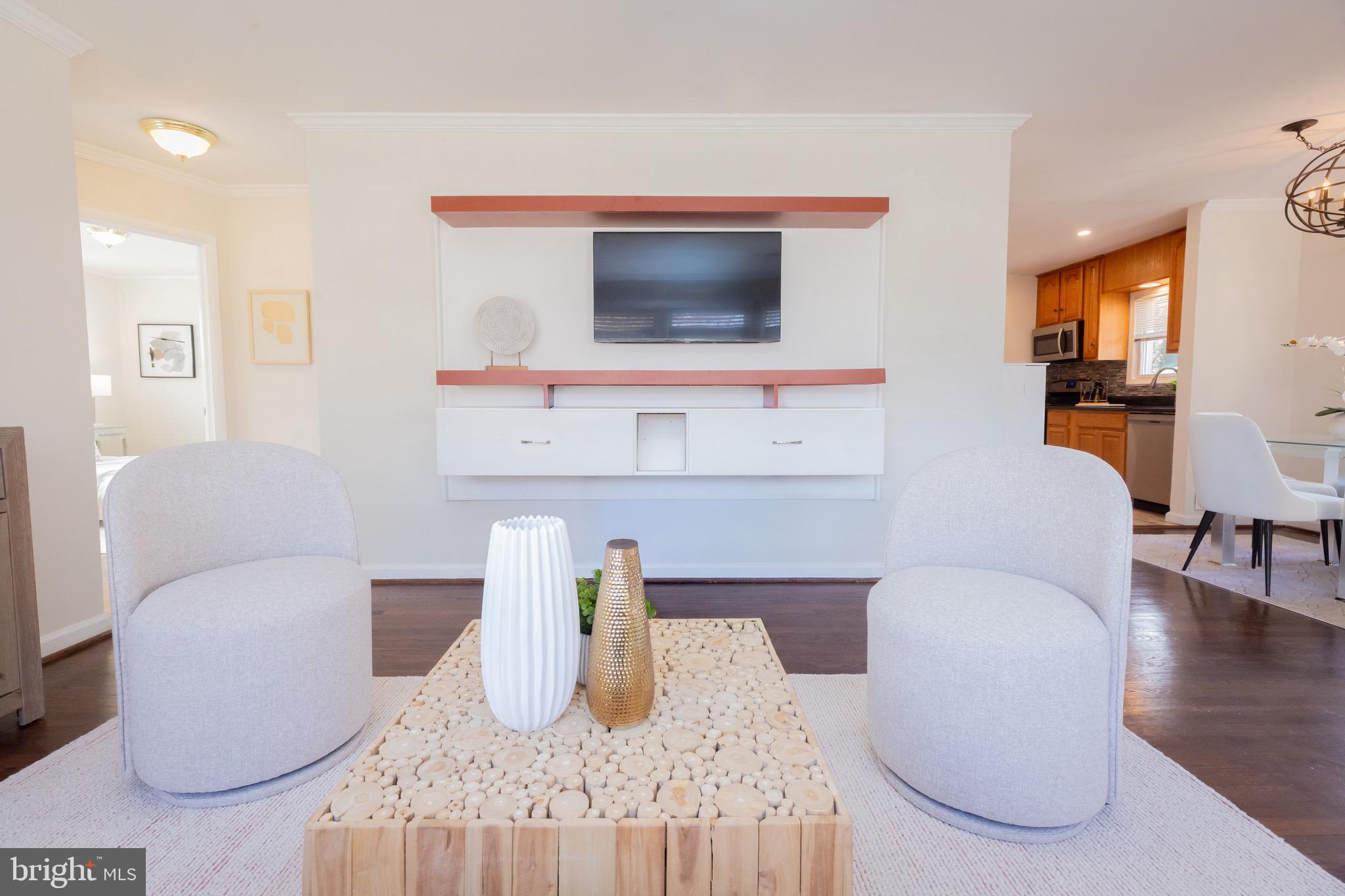 3945 Wendy Lane Silver Spring, MD 20906 - Photo 4 of 45 a living room with furniture and a flat screen tv