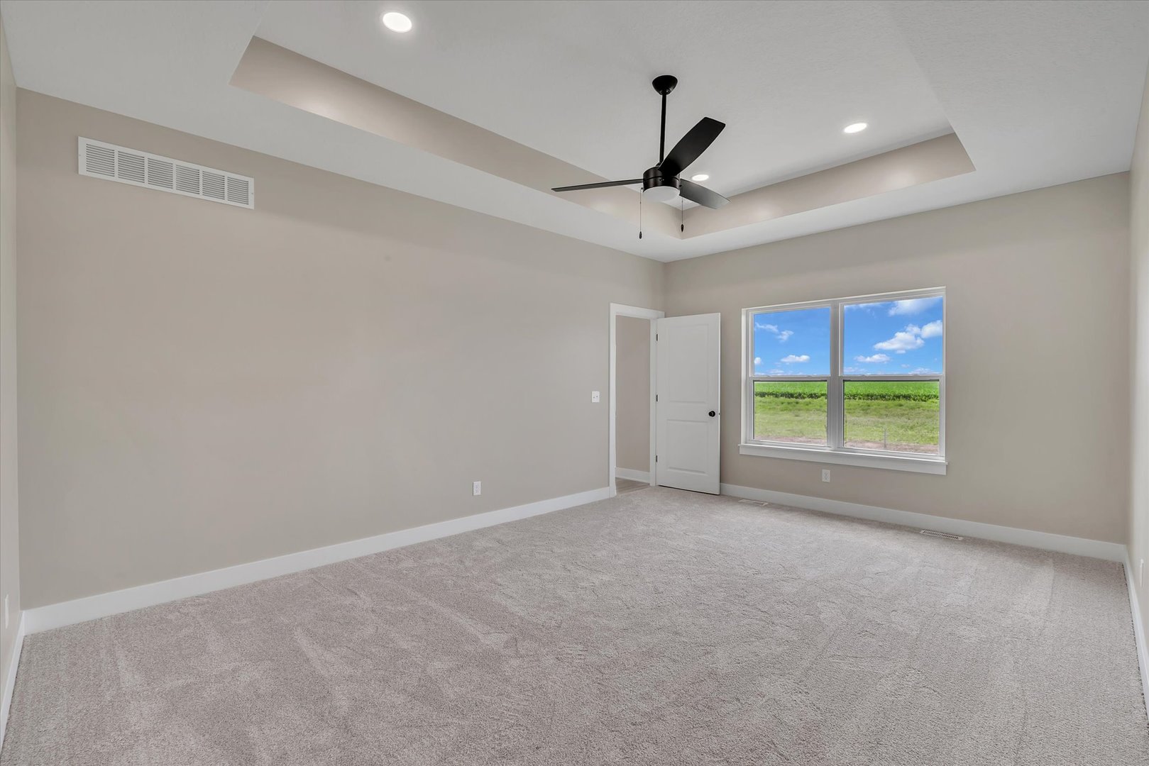 455 Rhonda Road New Liberty, IA 52765 - Photo 32 of 54 a view of room with a ceiling fan and window