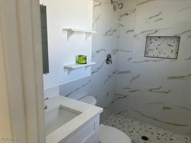 a bathroom with a sink and toilet