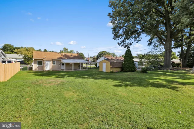 a aerial view of a house with a big yard
