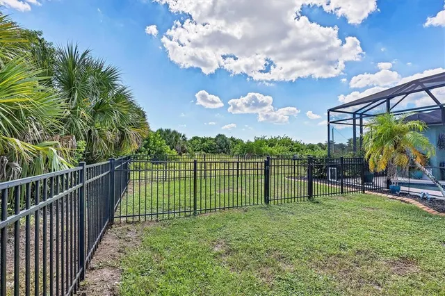 a view of a house with a backyard porch and sitting area
