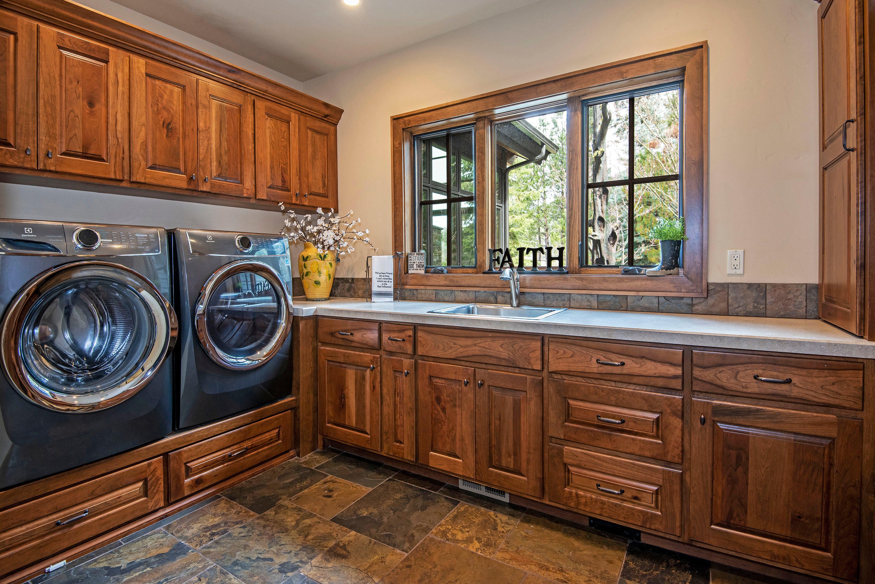 13778 Bishops Cap, Unit EM 8 Black Butte Ranch, OR 97759 - Photo 19 of 27 Huge Laundry with heated floors, hidden ironing board, laundry chute. Views of Black Butte.