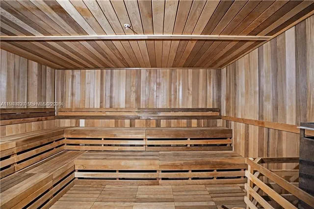 a bathroom with a window and a shower