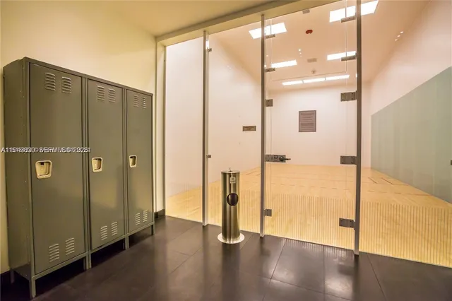 a view of front door with wooden floor