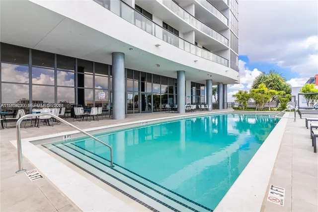 a view of a swimming pool with a patio
