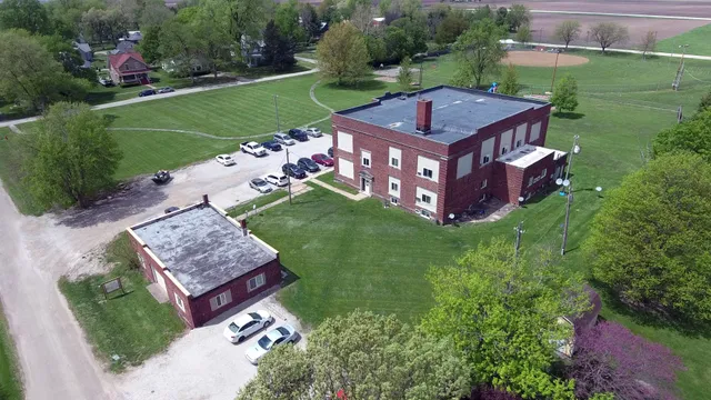 an aerial view of a house with garden space and street view