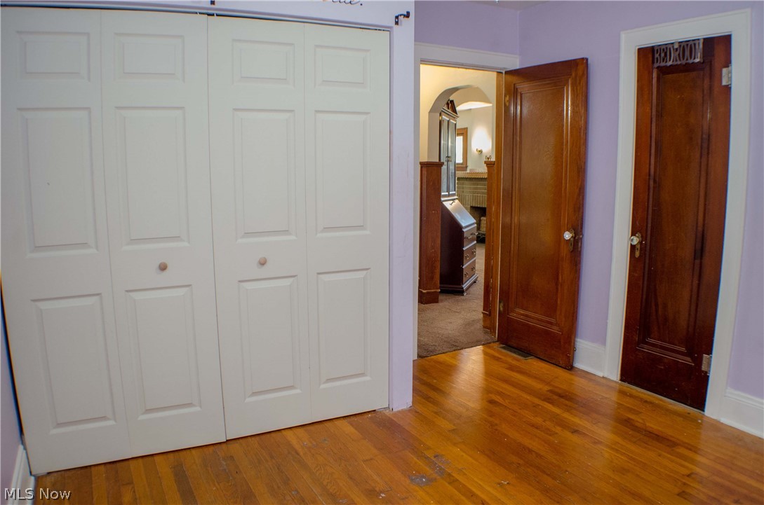 2324 Mogadore Road Akron, OH 44312 - Photo 19 of 26 2nd bedroom also has updated bi-fold closet doors along with a 2nd closet for additional storage (this is also the attic access)
