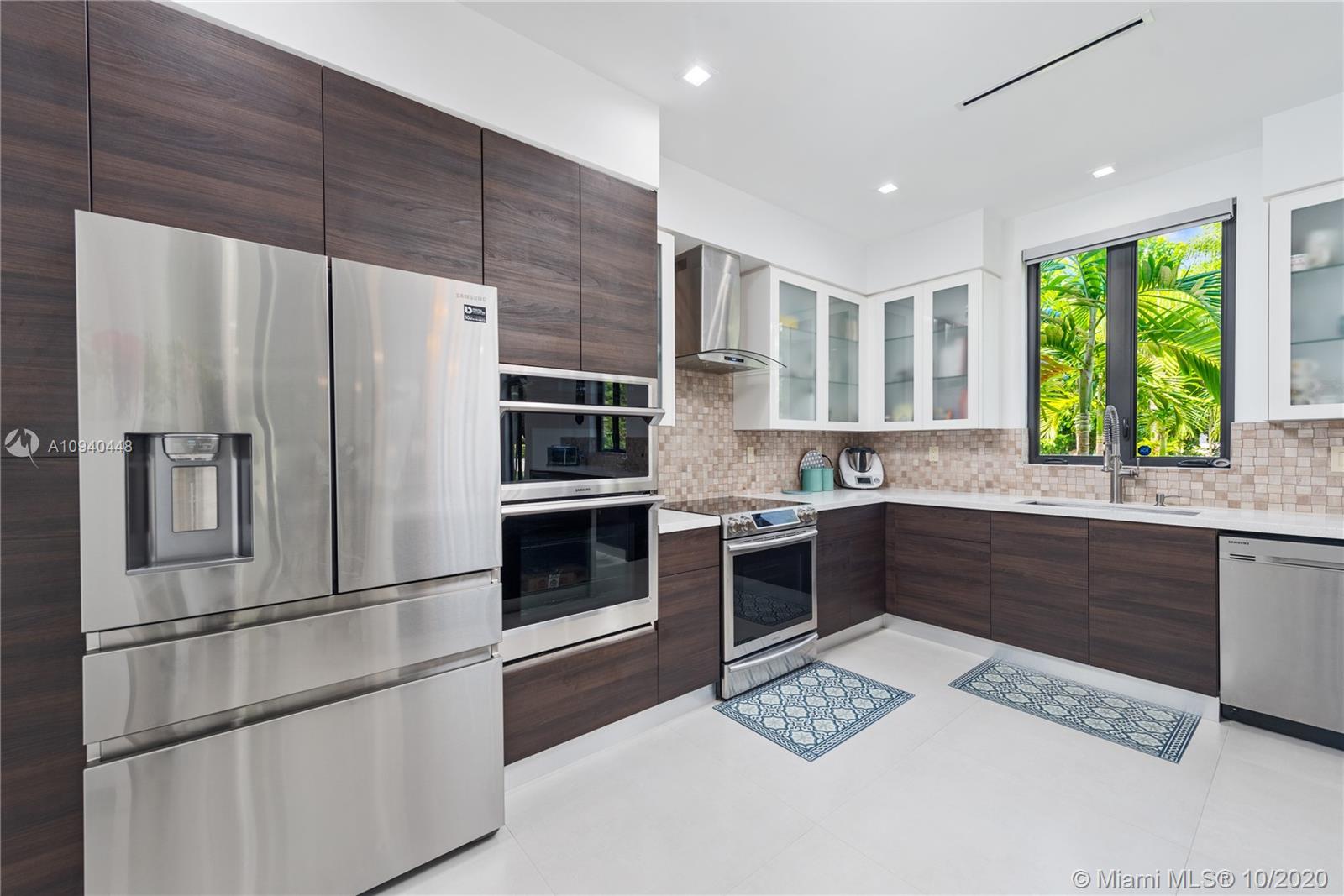 4200 Alhambra Circle Coral Gables, FL 33146 - Photo 18 of 34 Kitchen with 2 Ovens, Microwave, Refrigerator and Dishwasher Samsung