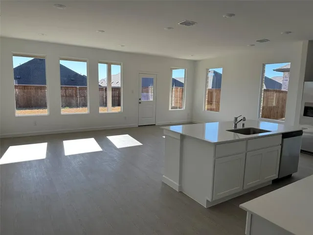 a view of house with yard in front of it