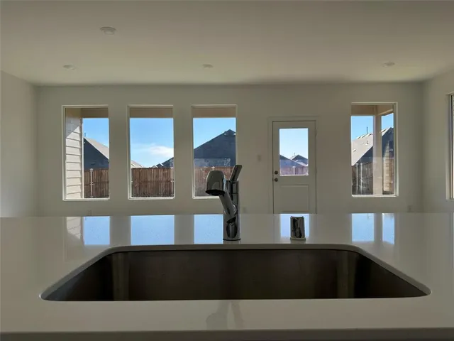 a living room with furniture and windows