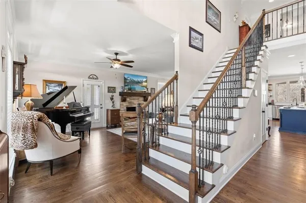 a kitchen with stainless steel appliances granite countertop a sink a stove and cabinets