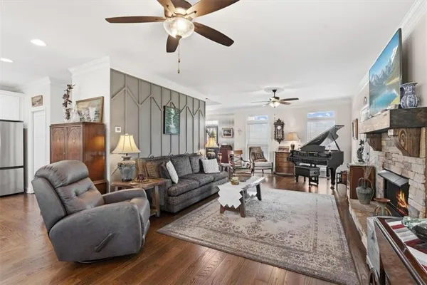 a spacious bedroom with a bed and ceiling fan