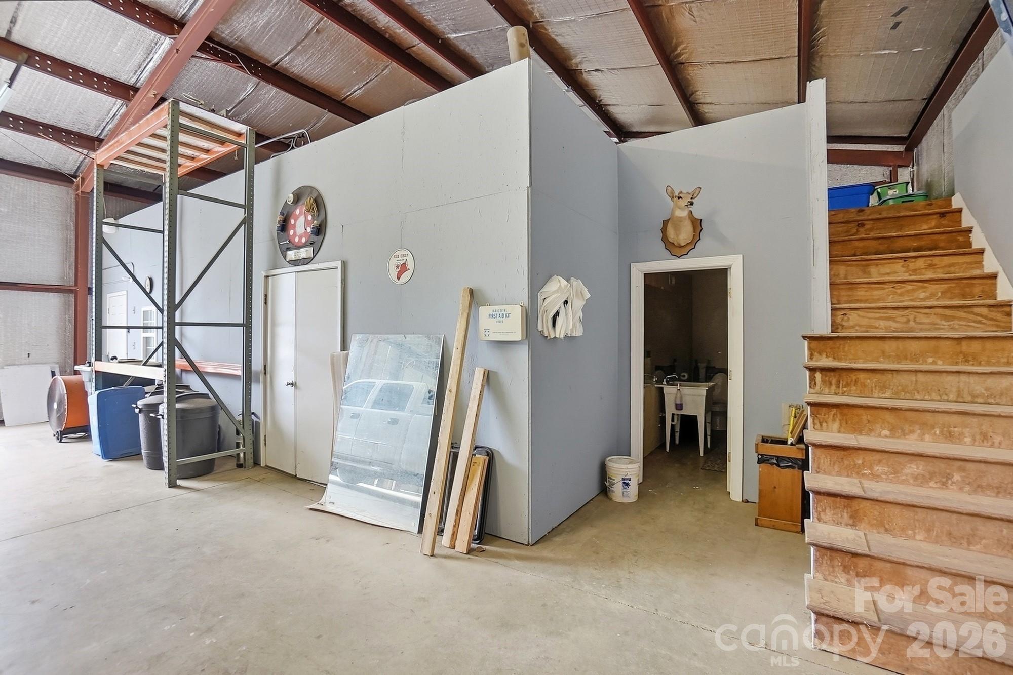 4017 Mullis Newsome Road Monroe, NC 28110 - Photo 38 of 38 a view of a storage room with stairs