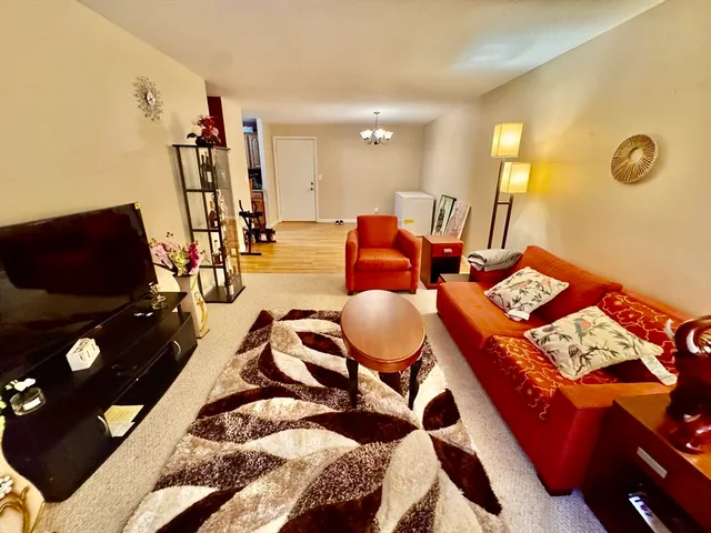a living room with furniture and flat screen tv