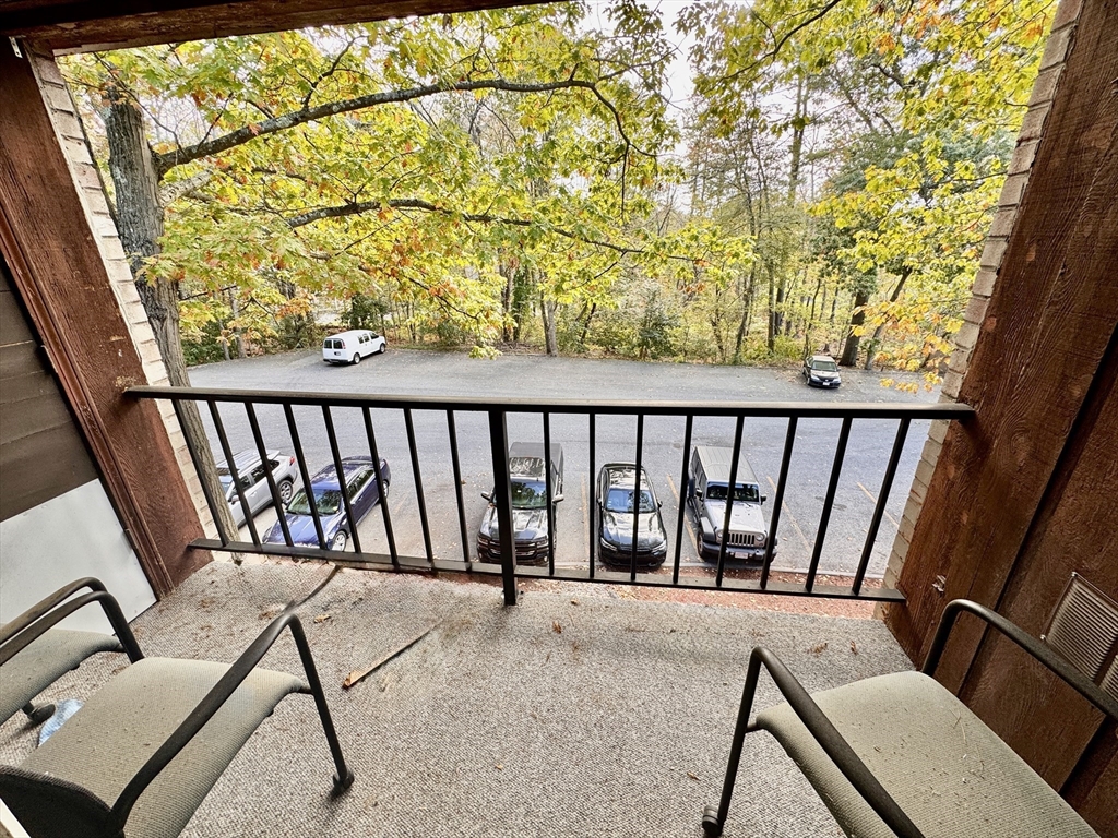 3 Greenbriar Drive, Unit 303 North Reading, MA 01864 - Photo 14 of 16 a view of a chairs and table in the balcony