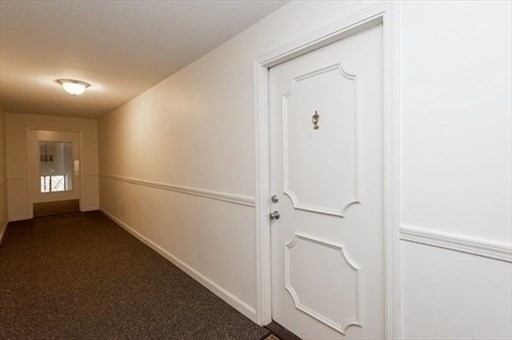 3 Greenbriar Drive, Unit 303 North Reading, MA 01864 - Photo 15 of 16 a view of a hallway with an entryway