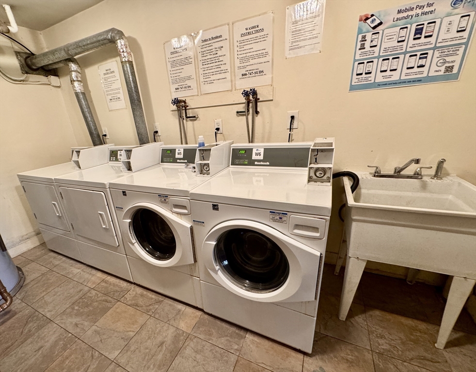 3 Greenbriar Drive, Unit 303 North Reading, MA 01864 - Photo 16 of 16 a utility room with dryer and washer