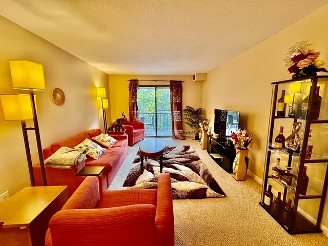 a view of a livingroom with furniture and lounge chair
