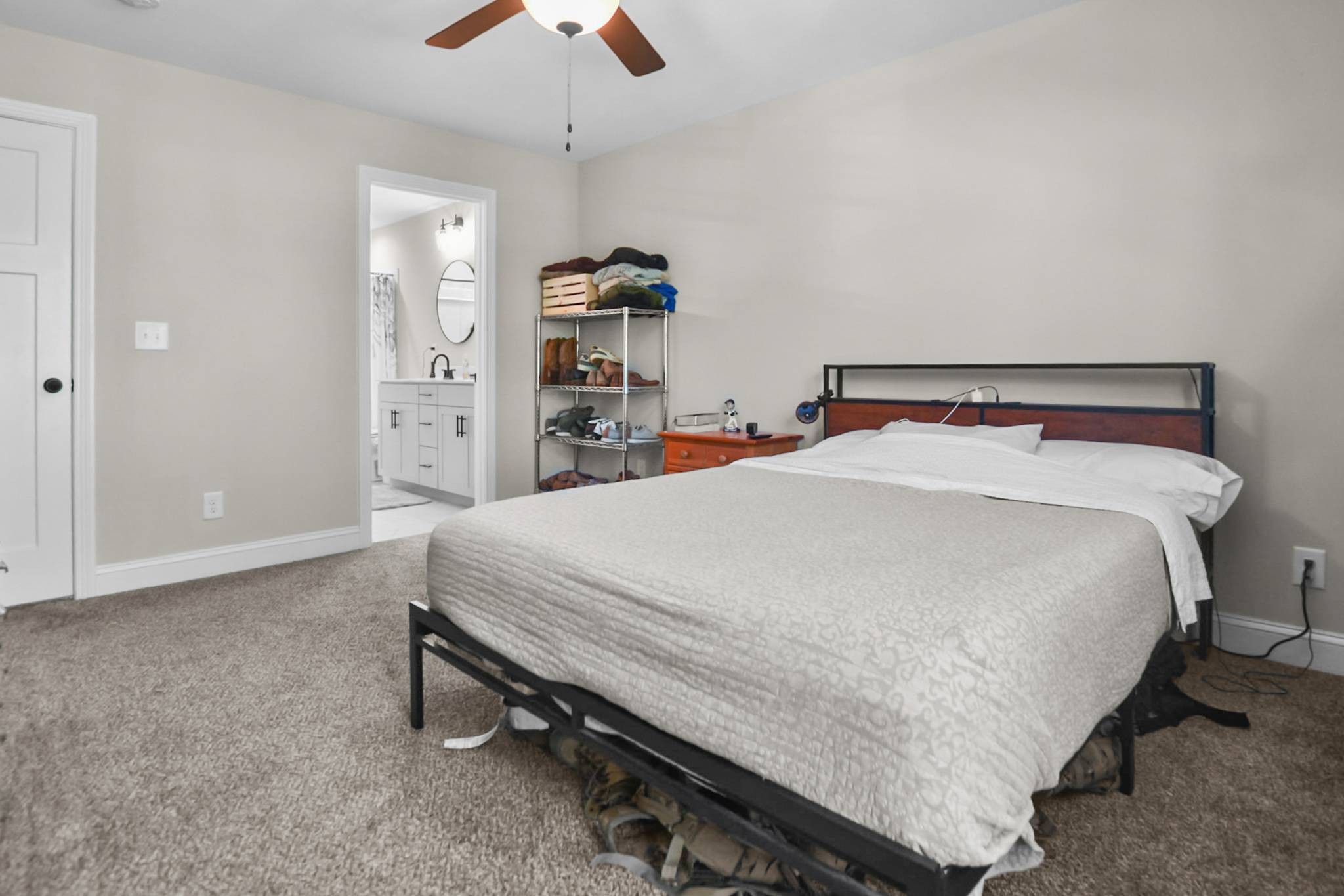 60 Cave Springs Road, Unit B Clarksville, TN 37042 - Photo 13 of 16 a bed sitting in a bedroom and kitchen view