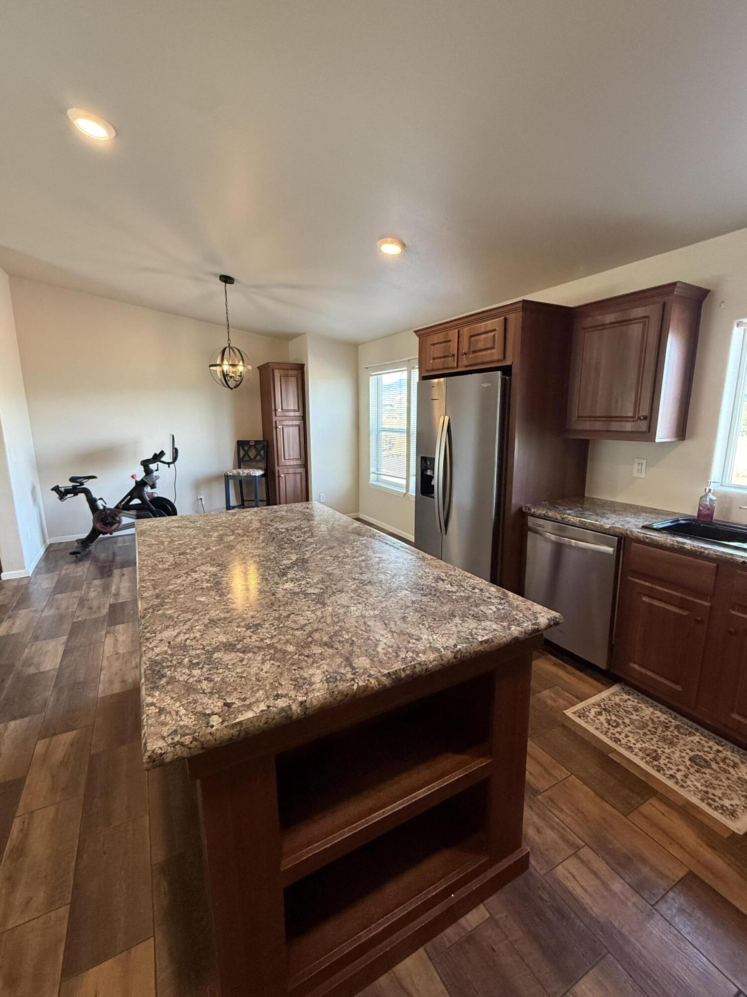 345 Old Mill Road Tonto Basin, AZ 85553 - Photo 6 of 33 a kitchen with kitchen island a sink stainless steel appliances and cabinets
