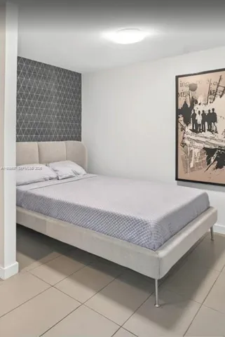 a large kitchen with stainless steel appliances granite countertop a sink and cabinets