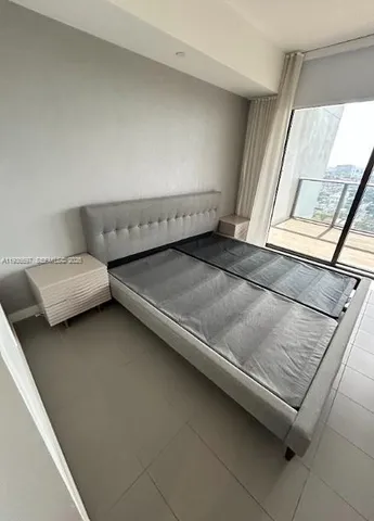 a living room with a couch and a flat screen tv