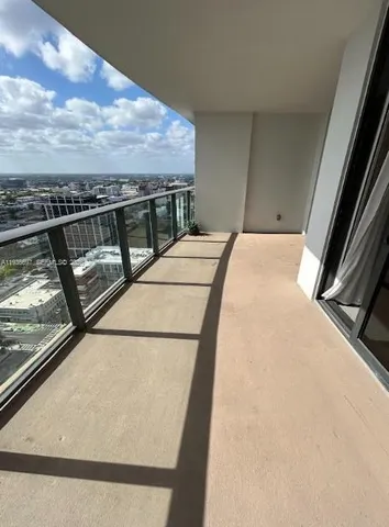a kitchen with stainless steel appliances a sink a stove and a microwave