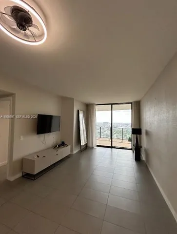 a bathroom with a sink toilet and painting on the wall