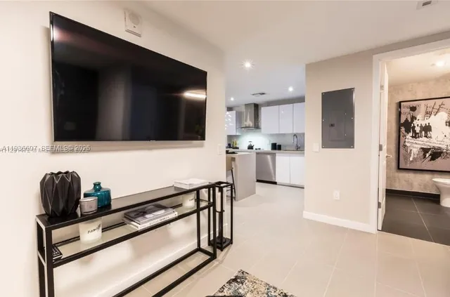 a bedroom with a large bed and a large window