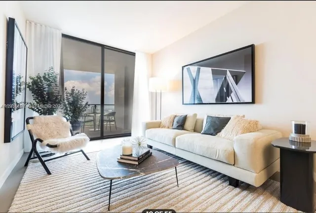 a bathroom with a toilet a sink and a mirror