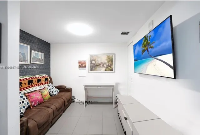 a living room with furniture and a couch