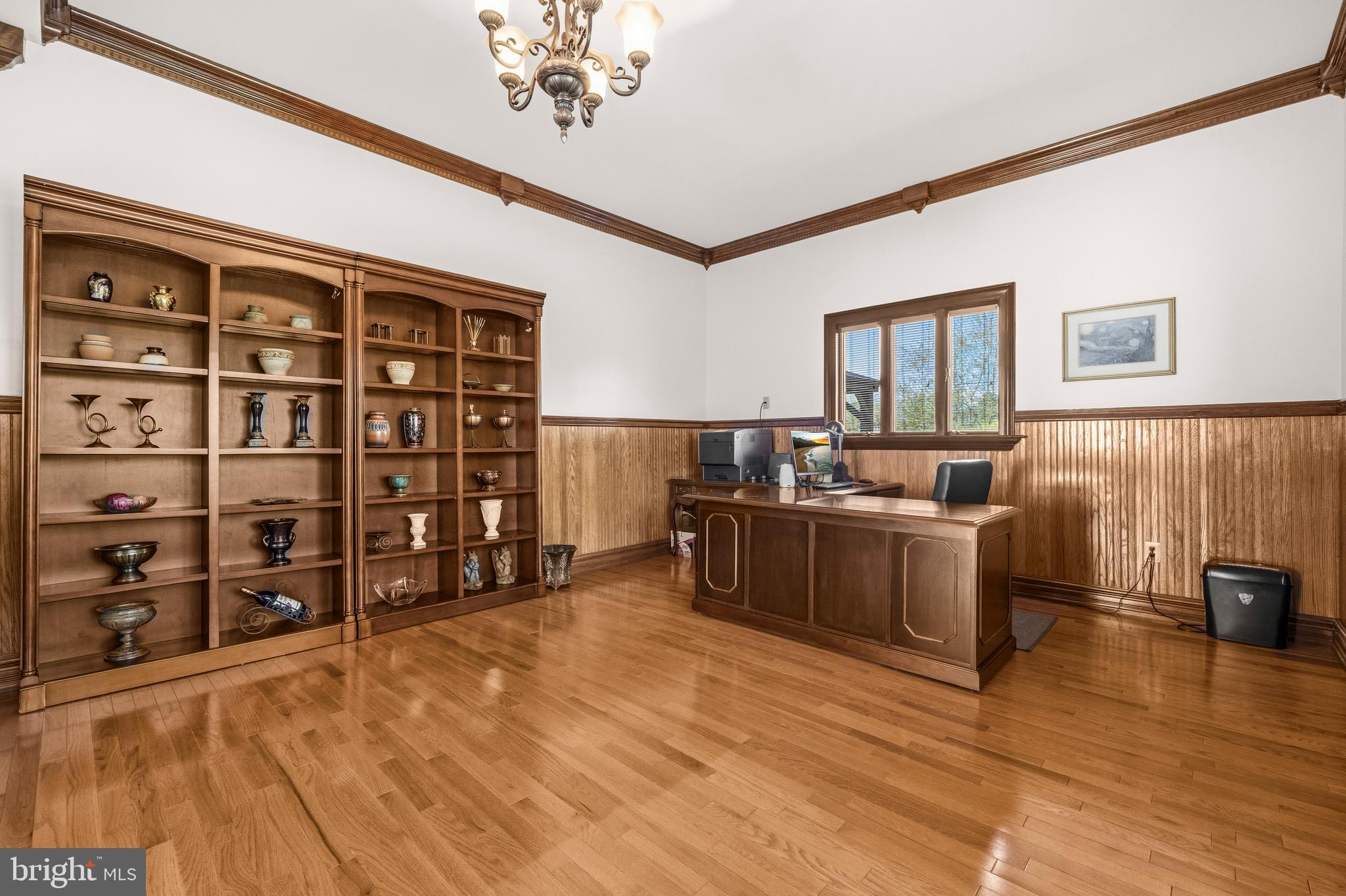 16170 Ed Warfield Road Woodbine, MD 21797 - Photo 17 of 80 a view of a bedroom with furniture and wooden floor