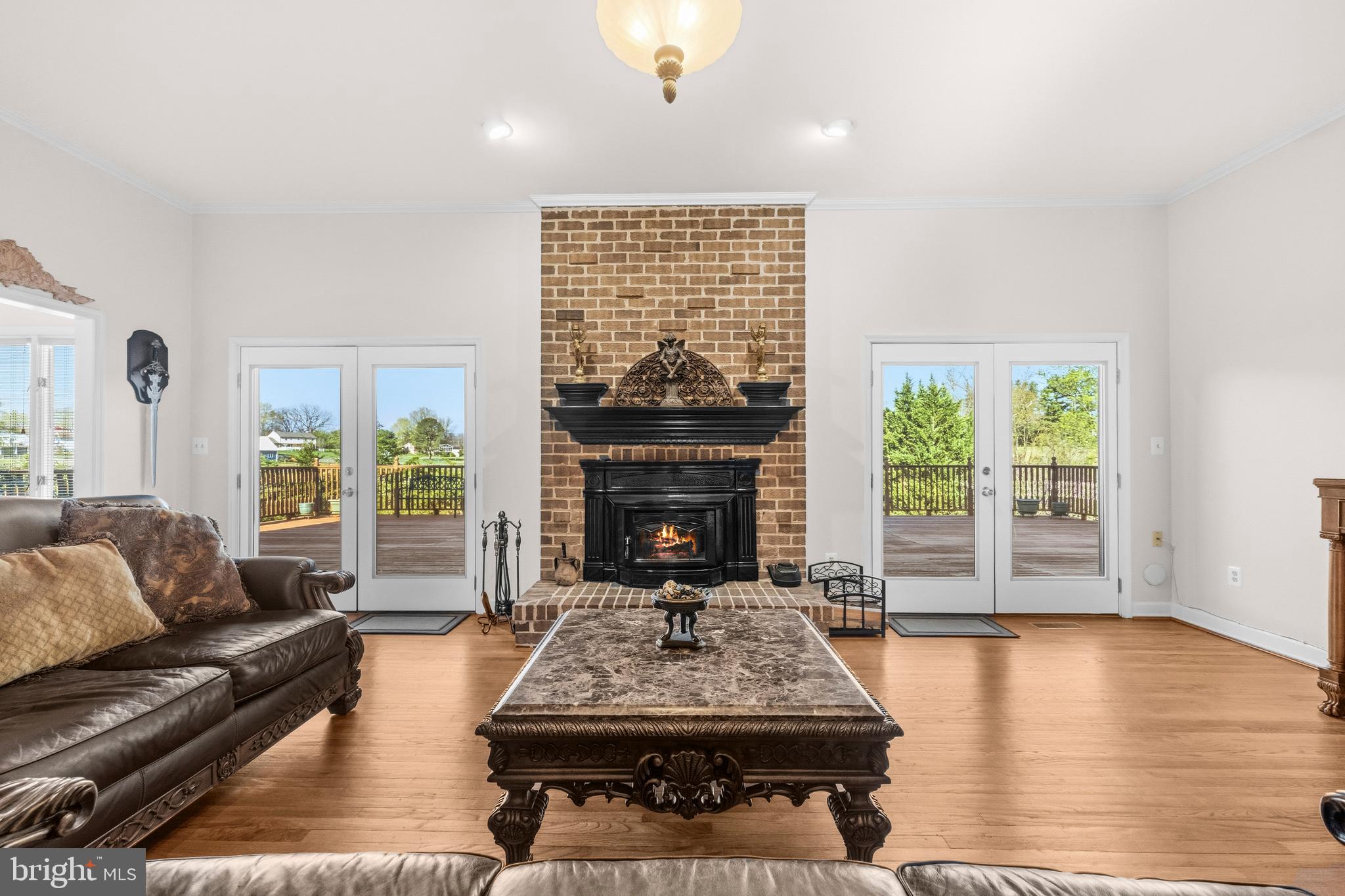 16170 Ed Warfield Road Woodbine, MD 21797 - Photo 19 of 80 a living room with furniture a fireplace and a table