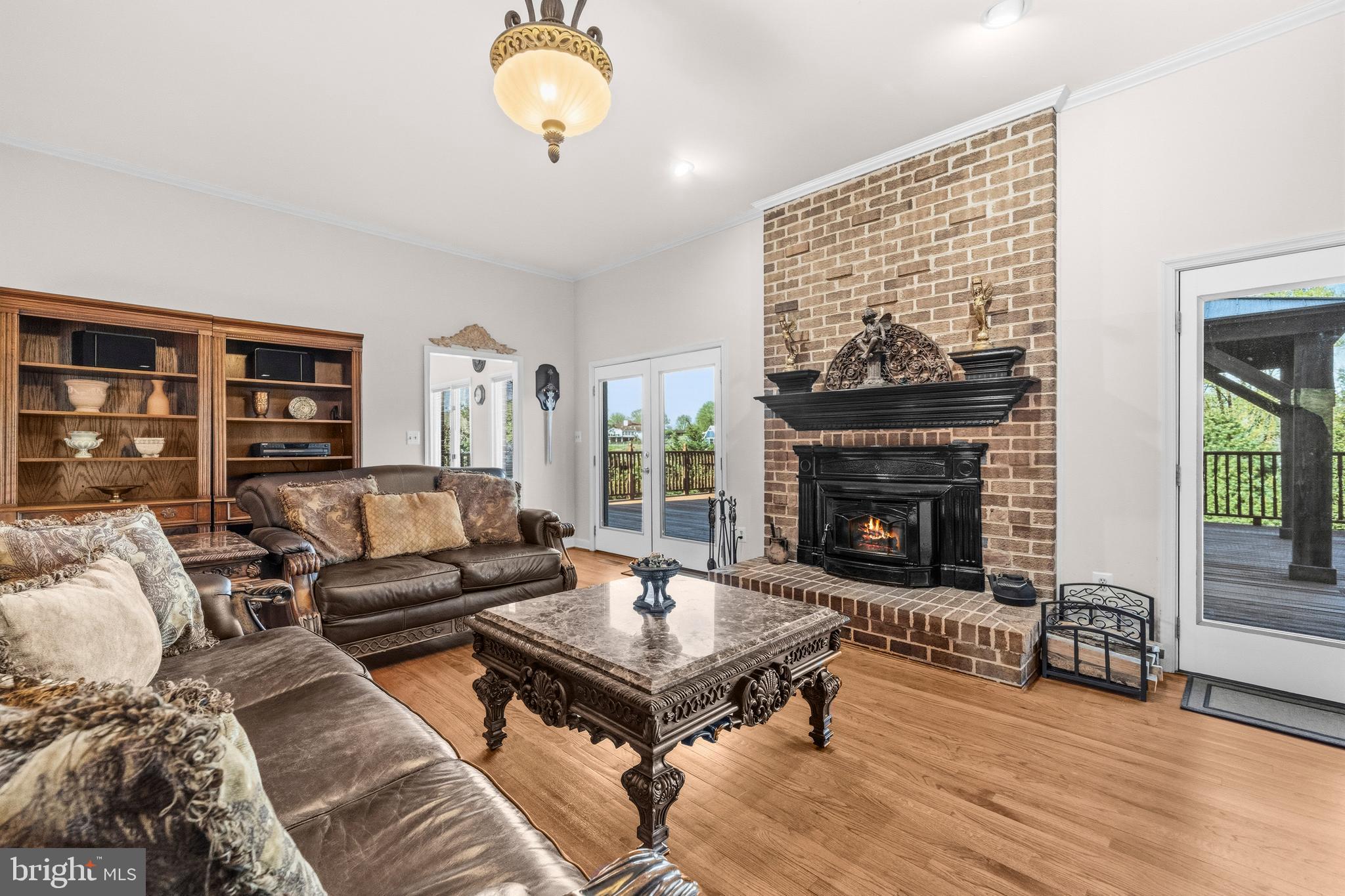 16170 Ed Warfield Road Woodbine, MD 21797 - Photo 20 of 80 a living room with furniture and a fireplace
