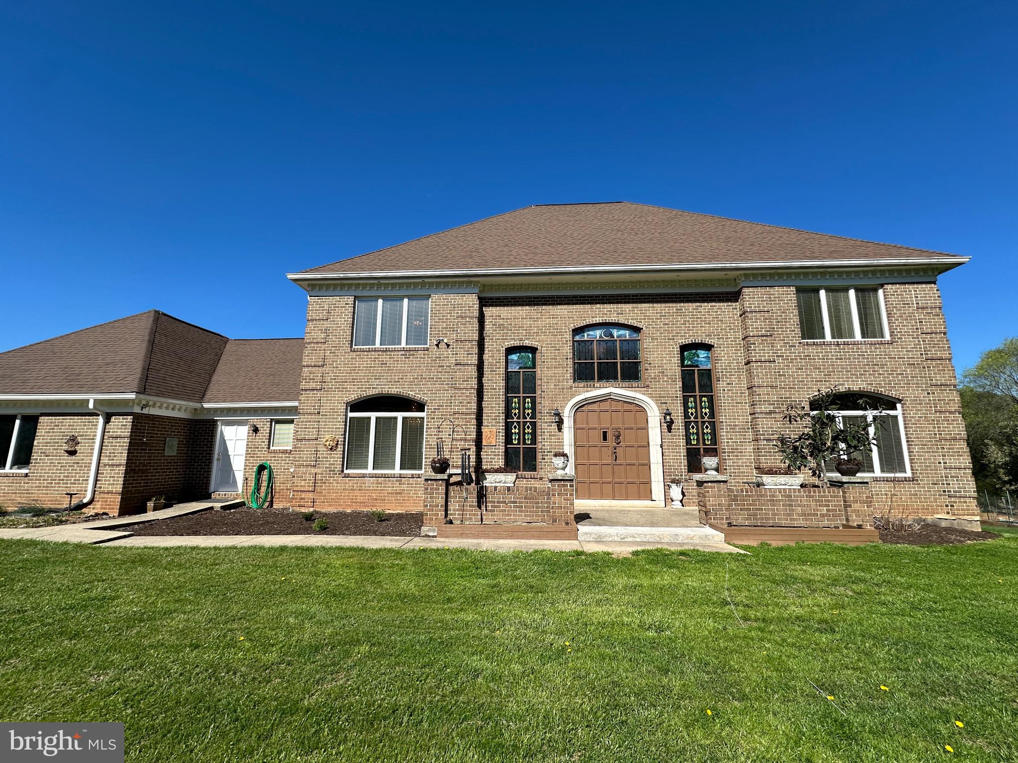 16170 Ed Warfield Road Woodbine, MD 21797 - Photo 2 of 80 a front view of a house with garden